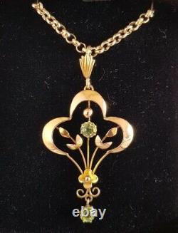 9ct yellow gold open work brooch / pendant. Peridot gemstones. Art nouveau period