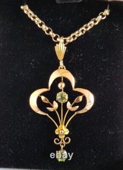 9ct yellow gold open work brooch / pendant. Peridot gemstones. Art nouveau period