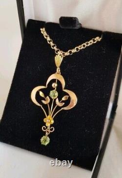 9ct yellow gold open work brooch / pendant. Peridot gemstones. Art nouveau period