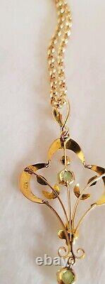 9ct yellow gold open work brooch / pendant. Peridot gemstones. Art nouveau period