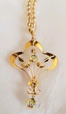 9ct yellow gold open work brooch / pendant. Peridot gemstones. Art nouveau period