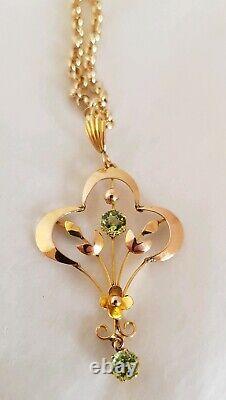 9ct yellow gold open work brooch / pendant. Peridot gemstones. Art nouveau period