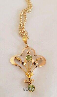 9ct yellow gold open work brooch / pendant. Peridot gemstones. Art nouveau period