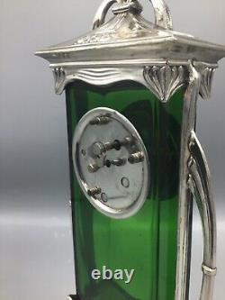 A German Art Nouveau silver plated metal and green glass mantel clock circa 1910