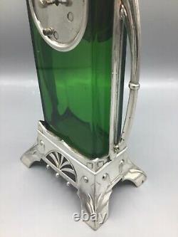 A German Art Nouveau silver plated metal and green glass mantel clock circa 1910