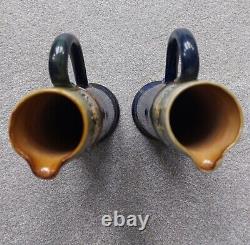 A pair of highly collectable Doulton Lambethware Art Nouveau taper jugs