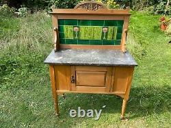 Antique Washstand with Green and Floral Art Nouveau Tiles and Carved Top