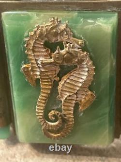 Art Nouveau cuff bracelet with seahorses on green bakelite. Good condition wide
