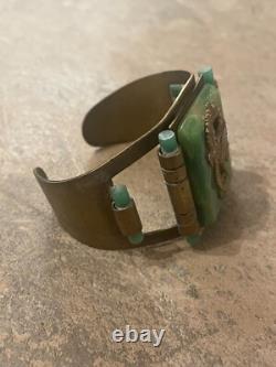 Art Nouveau cuff bracelet with seahorses on green bakelite. Good condition wide