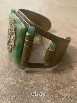 Art Nouveau cuff bracelet with seahorses on green bakelite. Good condition wide