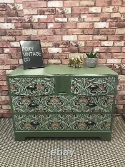 Art Nouveau print and bayberry green sideboard