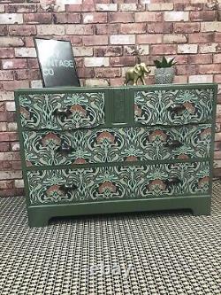 Art Nouveau print and bayberry green sideboard