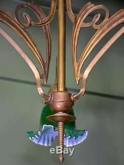 French Art Nouveau three light pendant with green glass lampshades