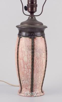 German ceramicist. Art Nouveau table lamp in in light and brown-green tones