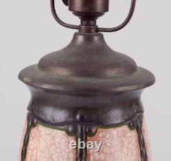 German ceramicist. Art Nouveau table lamp in in light and brown-green tones