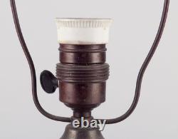 German ceramicist. Art Nouveau table lamp in in light and brown-green tones