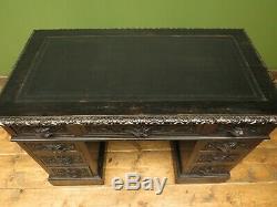 Green Man Carved Gothic Oak Pedestal Desk with Ebonized Finish and Leather Top