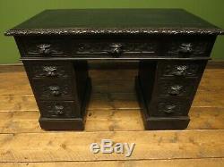 Green Man Carved Gothic Oak Pedestal Desk with Ebonized Finish and Leather Top