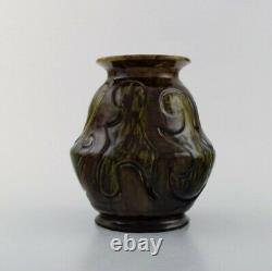 Møller & Bøgely, Denmark. Art nouveau vase in dark green glazed ceramics